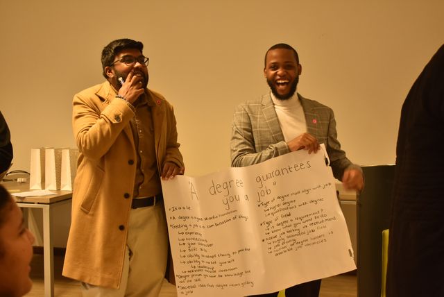 Participants holding a poster